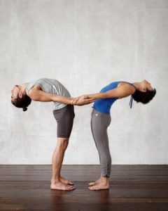 standing backbend yoga pose for two, partner yoga, 10 easy yoga poses for 2