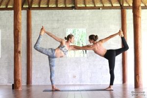 double high five yoga pose for 2, partner yoga, 10 easy yoga poses for two
